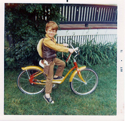 Bob Anderton pictured as a child with on an early bike.